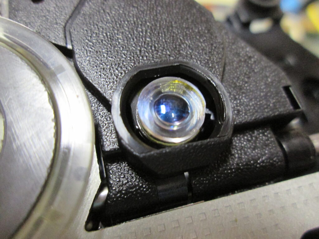 Laser pickup lens back in place