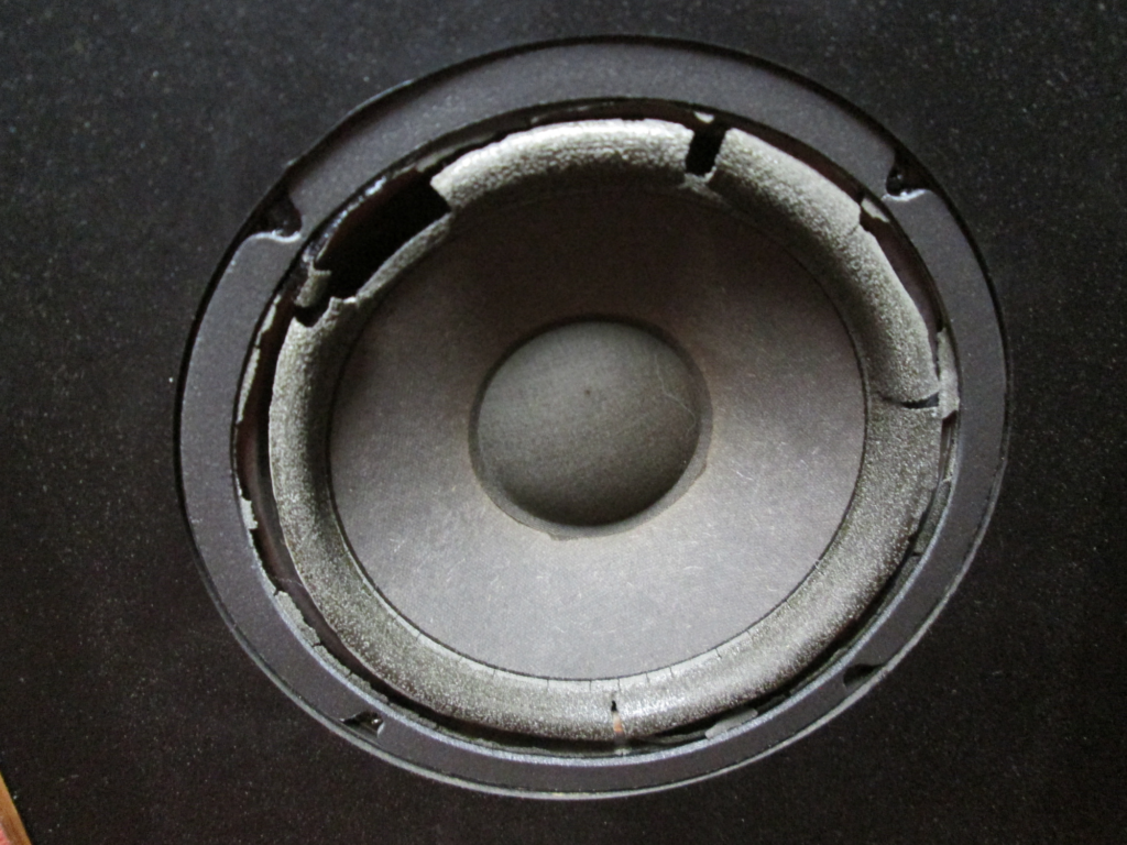 Closeup view of a Boston A70 woofer with deteriorated foam surround