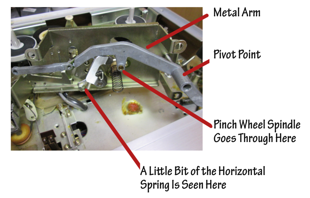 Underside of the play head assembly showing the lever arm and other components